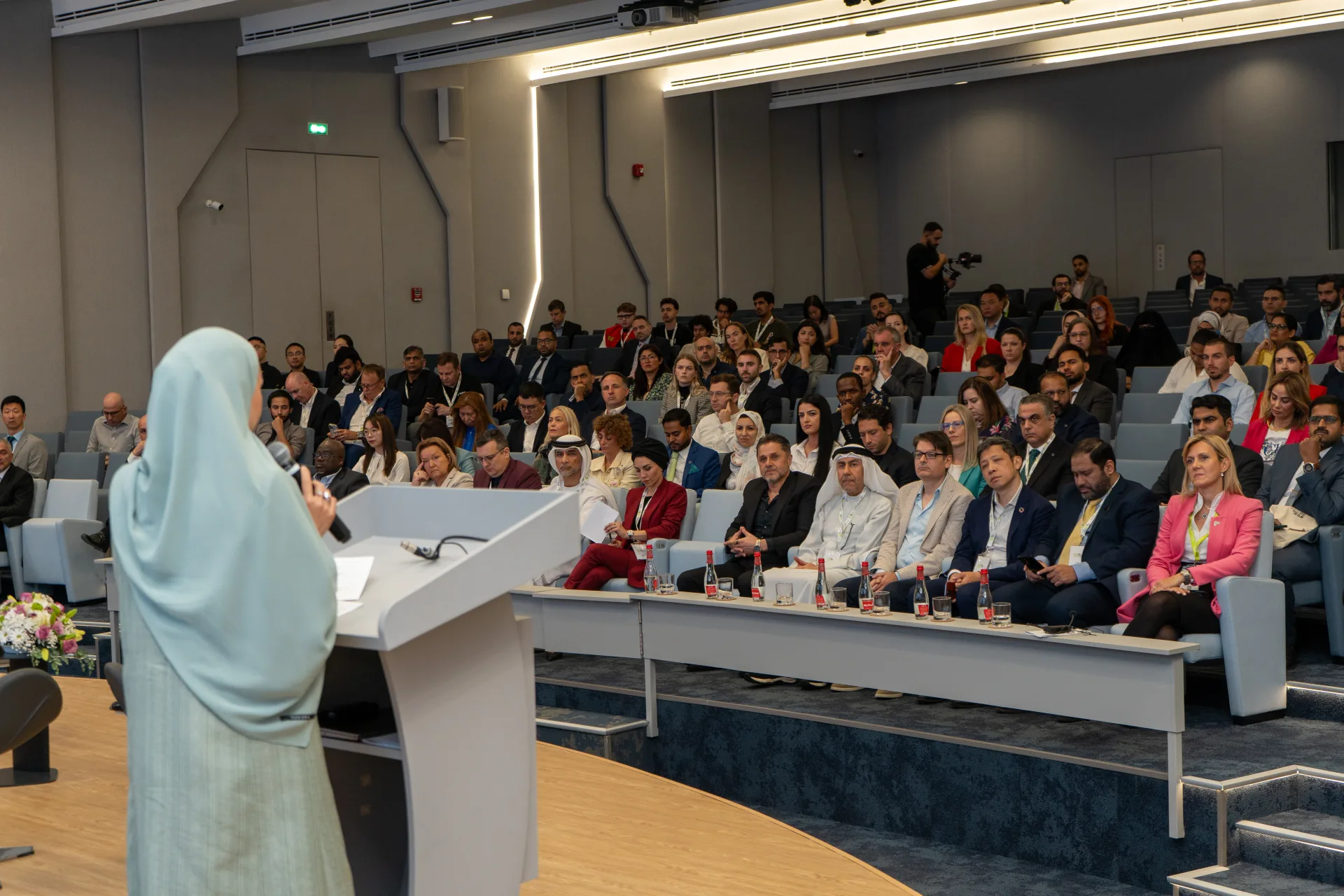 An audience listening to a speaker in the SEE Institute auditorium
