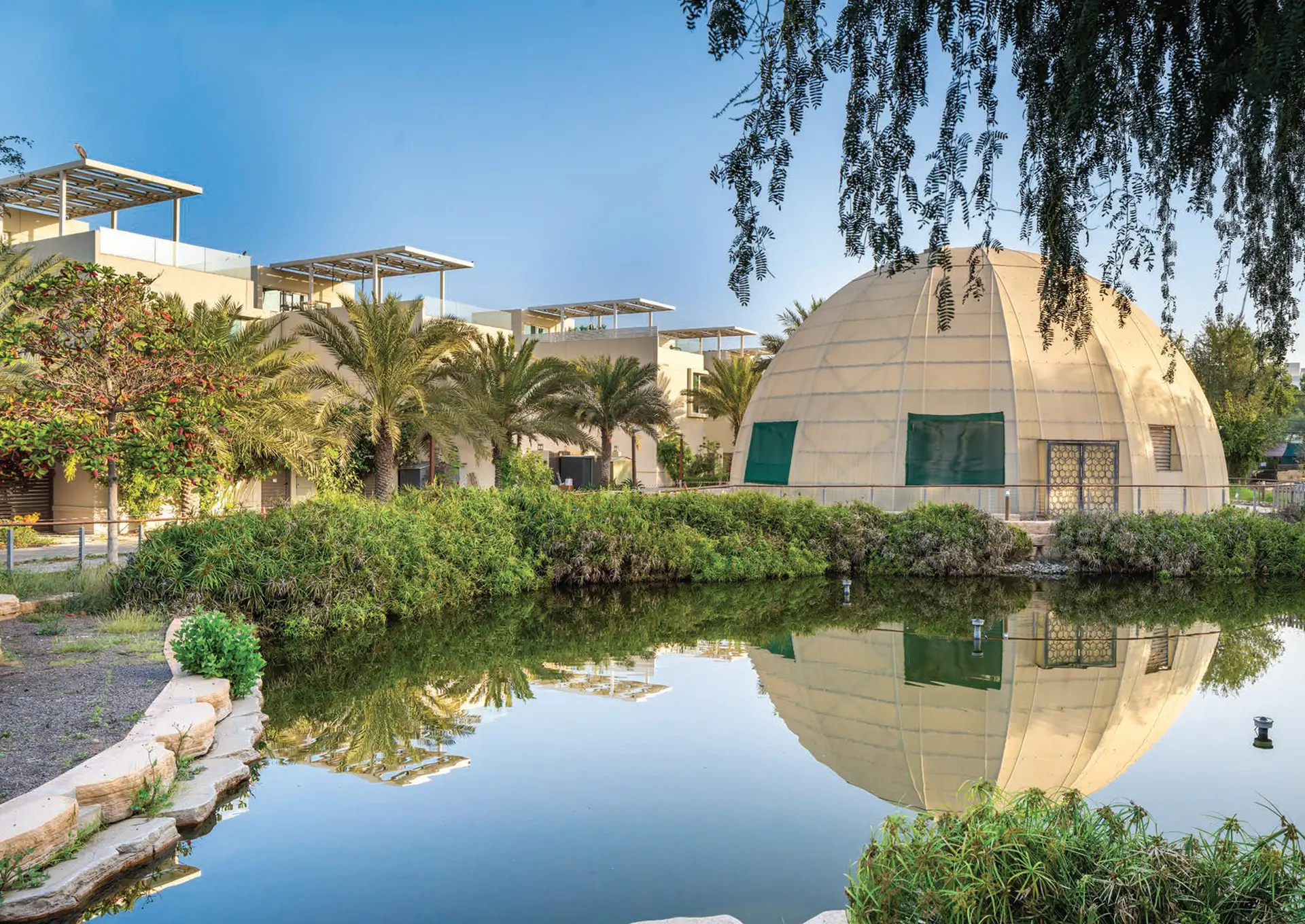 Biodomes beside the lake in The Sustainable City